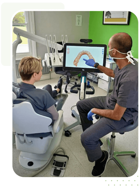 Patient with our Invisalign dentist reviewing 3D scan